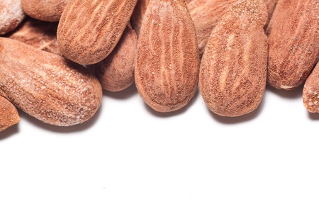 Group of almonds on a white background with copyspace belowの写真素材