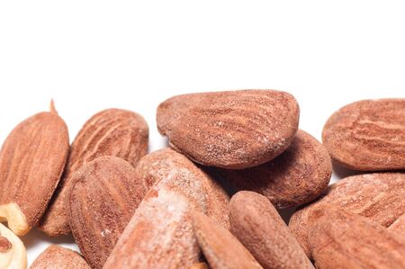 Group of almonds on a white background with copyspace aboveの写真素材
