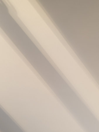 Abstract Shadows on Neutral Wall Backgroundの写真素材