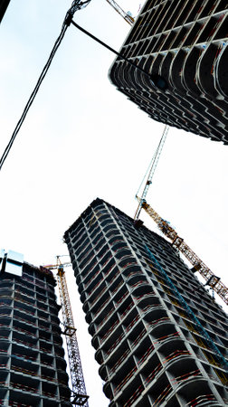 Modern buildings development, working at skyscaper building constructionの写真素材