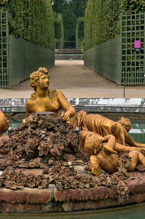 bronze statue in the park of Versailles Palaceの写真素材