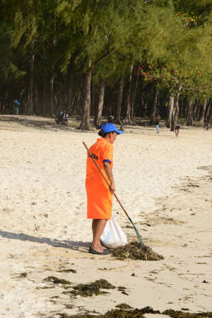 Africa, a woman sweep in La Pointe Aux Canonniers in Mauritiusのeditorial素材