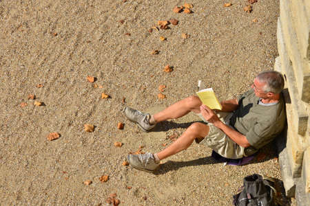 Ile de France, a man is reading in the parc of Versailles Palaceのeditorial素材