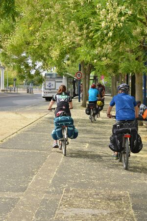 Cergy le Haut, France - august 8 2015 : cyclist in the center of the modern cityのeditorial素材