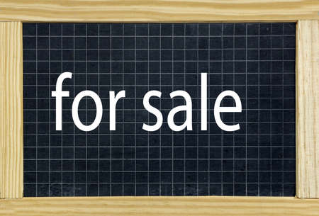 for sale written on a chalkboardの写真素材