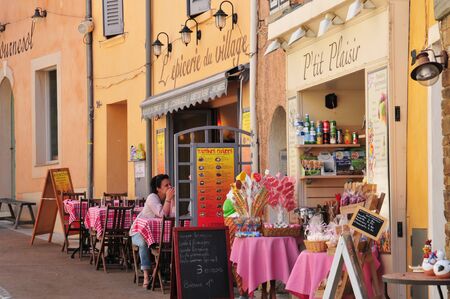 Bormes les Mimosas, France - april 18 2016 : restaurant in the old village in springのeditorial素材