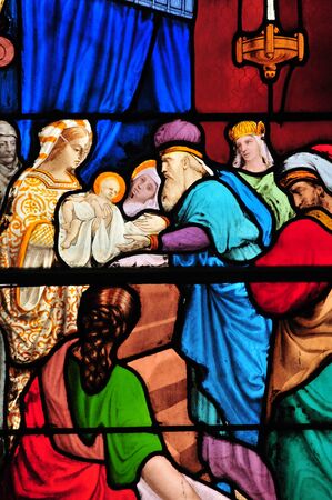 Triel sur Seine, France - april 3 2016 : Mary and Jesus on historical stained glass window in Saint Martin churchのeditorial素材