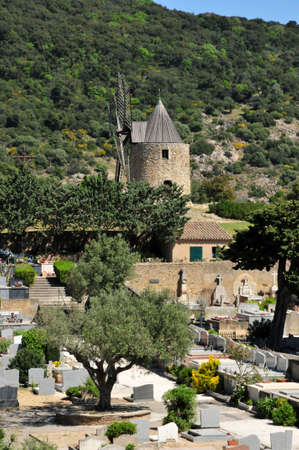the cemetery and the wind mill in Grimaud, Franceの写真素材