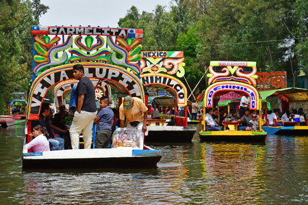 Mexico;  United Mexican State - may 13 2018 : touristy and restaurant boat on the canal in Xochimilco boroughのeditorial素材