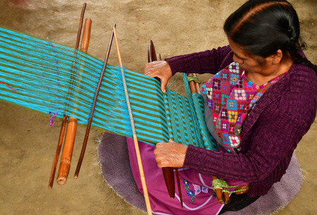 Zinacantan; United Mexican States - may 15 2018 : a weaver in the village centre