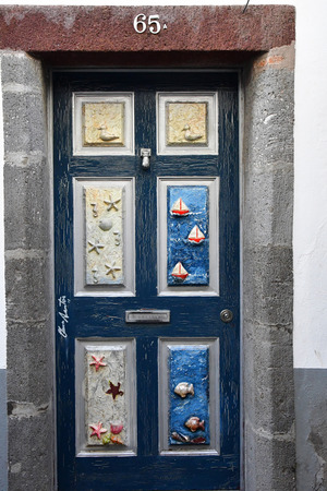 Funchal, Portugal - february 21 2018 : painted door in the Santa Maria streetのeditorial素材