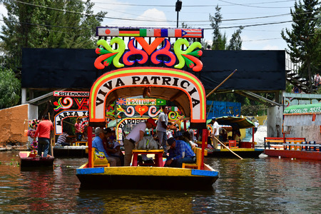 Mexico;  United Mexican State - may 13 2018 : touristy and restaurant boat on the canal in Xochimilco boroughのeditorial素材