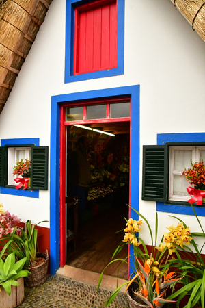 Santana, Madeira, Portugal - february 23 2018 : the traditional Madeirense colored houseのeditorial素材