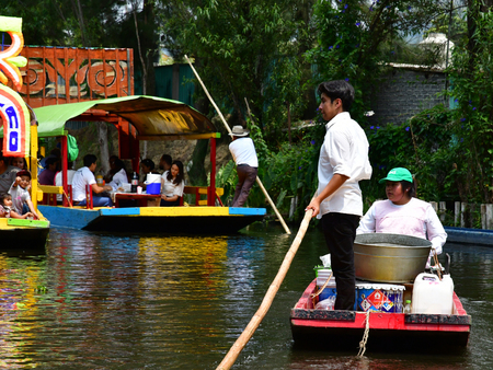 Mexico;  United Mexican State - may 13 2018 : touristy and restaurant boat on the canal in Xochimilco boroughのeditorial素材