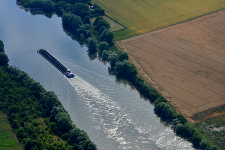 Rosny sur Seine, France - july 7 2017 : aerial photography of a barge on the Seine riverの写真素材