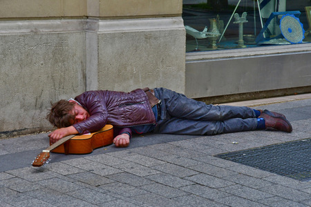 Paris; France - april 2 2017 : homeless man in the Avenue des Champs Elysees in the 8 th arrondissementのeditorial素材