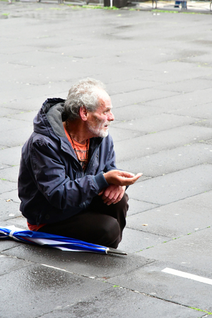 Funchal, Madeira, Portugal - february 21 2018 : an homeless person beg near the cathedralのeditorial素材