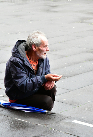 Funchal, Madeira, Portugal - february 21 2018 : an homeless person beg near the cathedralのeditorial素材