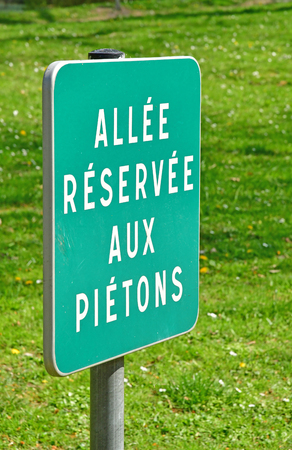 Poissy; France - april 11 2019 : path reserved for pedestrian sign in the Meissonier park in springのeditorial素材