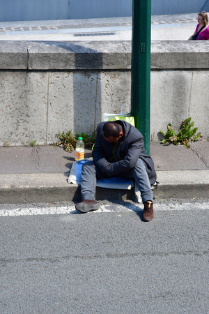 Paris; France - april 2 2017 : an homeless man near Alma bridgeのeditorial素材