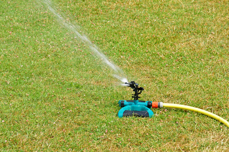 Harquency; France - july 19 2019 : la Grange de Bourgoult, watering lawnのeditorial素材