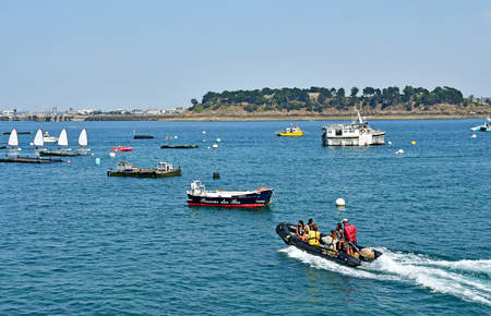 Dinard; France - july 23 2019 : people in a rubber dinghy near the coastのeditorial素材