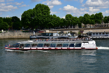 Paris; France - april 2 2017 : touristy boat near the Alexandre 3 bridgeのeditorial素材