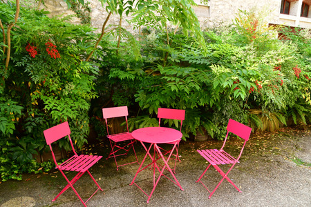 Chaumont sur Loire; France - june 29 2019: pink chairs and table in the castle farm built in 1900のeditorial素材
