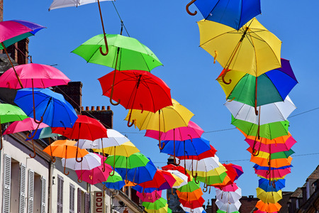 Les Andelys; France - july 2 2019 : the Marcel Lefevre street decorated with multicoloured umbrellasのeditorial素材