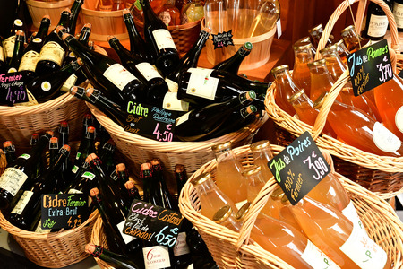 Cabourg; France - august 8 2019 : cider bottles in basketのeditorial素材