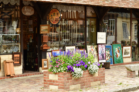 Beuvron en Auge; France - august 8 2019 : antique shop in the picturesque village in summerのeditorial素材