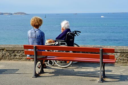 Dinard; France - july 28 2019 : old woman are looking the seaside