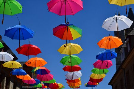 Les Andelys; France - july 2 2019 : the Marcel Lefevre street decorated with multicoloured umbrellasの写真素材