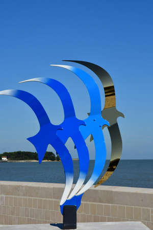 Rivedoux Plage, ile de Re, France - march 13 2020 : modern sculpture of birds near the picturesque seasideのeditorial素材