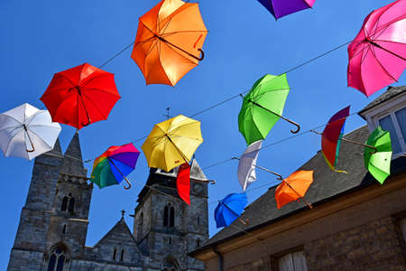 Les Andelys; France - july 2 2019 : the Marcel Lefevre street decorated with multicoloured umbrellasのeditorial素材