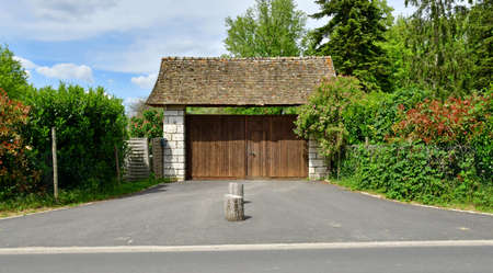 Ivry la Bataille; France - June 23, 2021: portal in the picturesque villageのeditorial素材