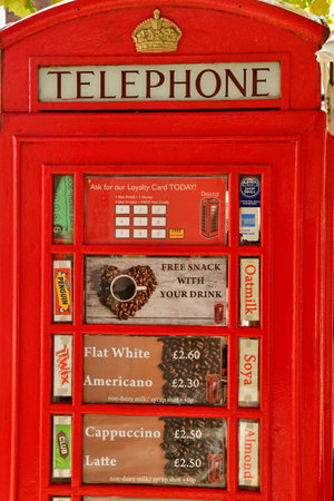 London; Hampstead; England - October 21 2021: Cafe in a phone box in the Belsize Park district