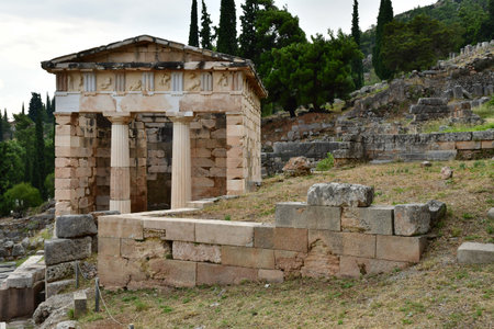Delphi; Greece - August 31 2022: the Athenian Treasury in the archaeological site