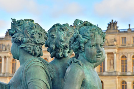 Versailles; France - November 26 2024: the castle of Louis 14, bronze statue on the water parterreのeditorial素材
