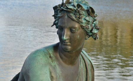 Versailles; France - November 26 2024: the castle of Louis 14, bronze statue on the water parterreのeditorial素材