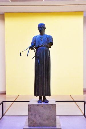 Delphi; Greece - August 31 2022: the Charioteer of Delphi in the archaeological museumのeditorial素材