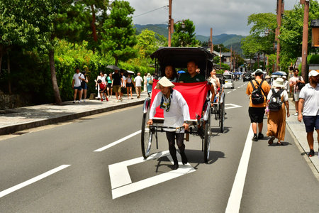 Kyoto; Japan - August 10 2024: rickshaw in Arashiyama city center