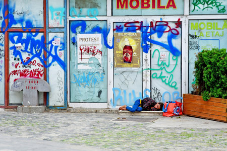 Bucharest, Romania - July 2 2023: homeless woman in the city centerのeditorial素材