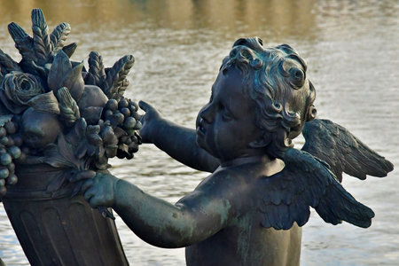 Versailles; France - November 26 2024: the castle of Louis 14, bronze statue on the water parterreのeditorial素材