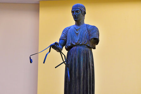 Delphi; Greece - August 31 2022: the Charioteer of Delphi in the archaeological museumのeditorial素材