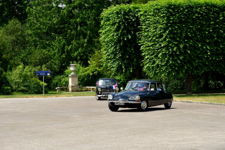 Rambouillet, France - June 18 2023: old car in front of the historical castleのeditorial素材