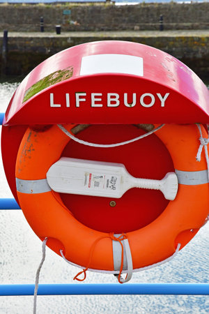 Carrickfergus; Northern Ireland - September 15 2022: lifebuoy near the harborのeditorial素材