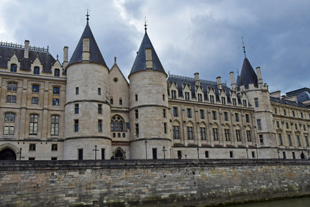 Paris; France - April 27 2023: La Conciergerie seen from a tourist boat river on the Seineのeditorial素材