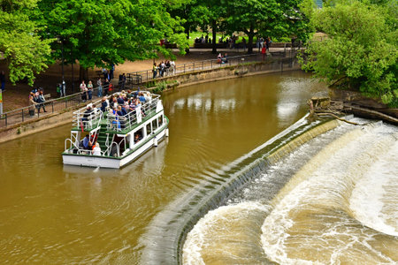 Bath; England - May 30 2024: the Avon river in the picturesque city centerのeditorial素材