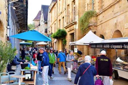 Sarlat la Caneda; France - October 7 2023: the picturesque Saturday marketのeditorial素材